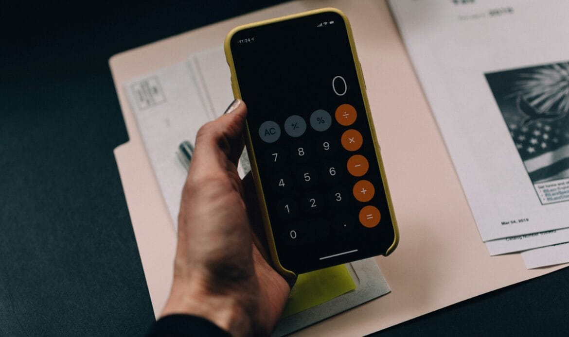 Entrepreneur reviewing Romanian business tax regulations and compliance reports.