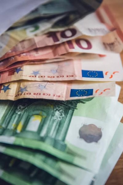 Financial Structuring Services at LegalHunt Euro banknotes placed on a wooden surface, symbolizing business finance and structuring