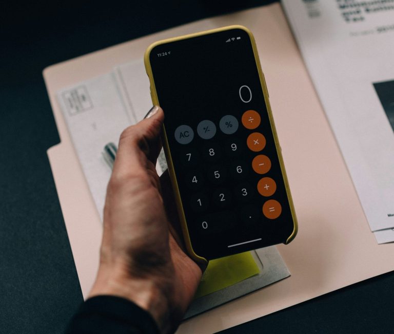 Entrepreneur reviewing Romanian business tax regulations and compliance reports.