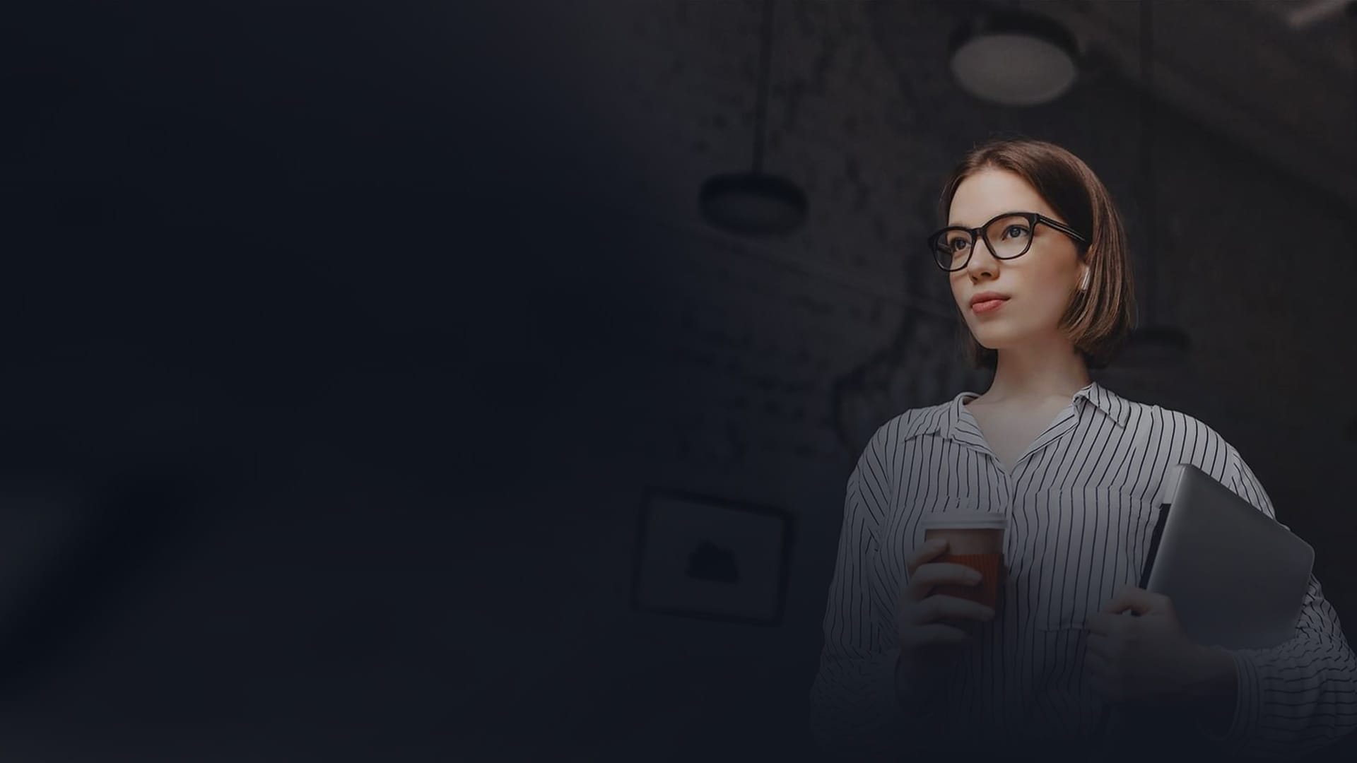 Entrepreneur holding a coffee and laptop, symbolizing business vision and legal expertise.
